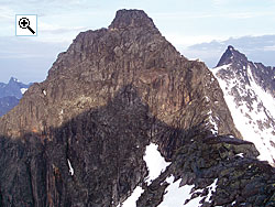 Sentraltind in morning light seen from the saddle with Styggedalstind