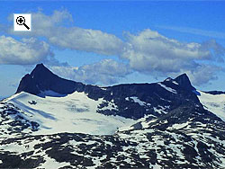 The east face of Falketind (left) is a steep wall above the crevassed Falkbreen glacier