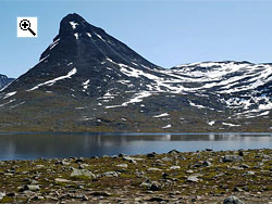 Kyrkja rises above Leirvatnet lake as seen from Leirvassbu lodge